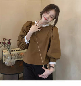 Loose retro long-sleeved design and stylish belted pullover top