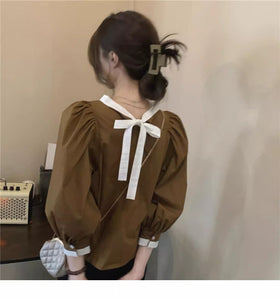 Loose retro long-sleeved design and stylish belted pullover top